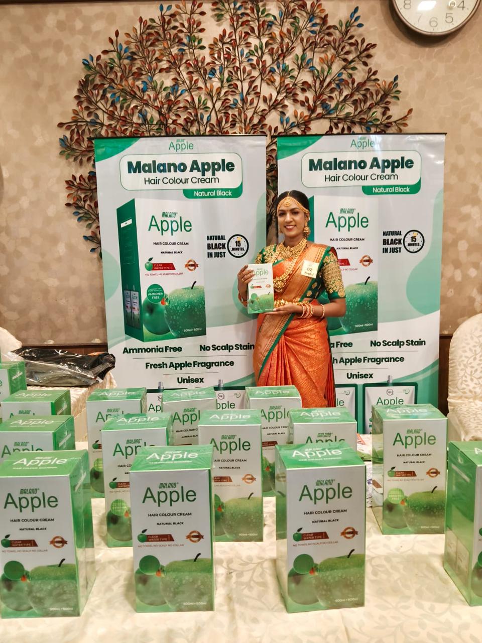 Second wide exhibition booth display showing product arrangement and backdrop branding